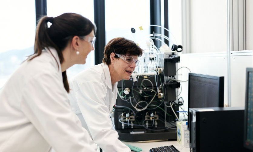 Female scientists working on a computer